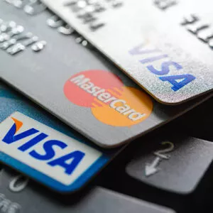 Bangkok, Thailand - Jun 23, 2015 : Group of credit cards on computer keyboard with VISA and MasterCard brand logos